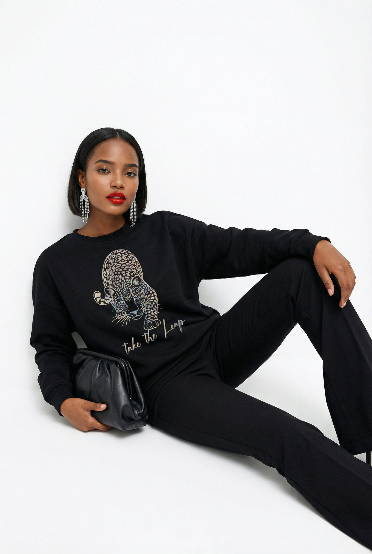 Gold Take the Leap Leopard jumper  in Black